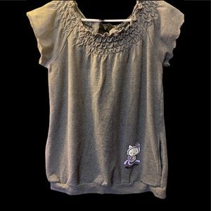 Sweater style shirt. Very cute and comfy!